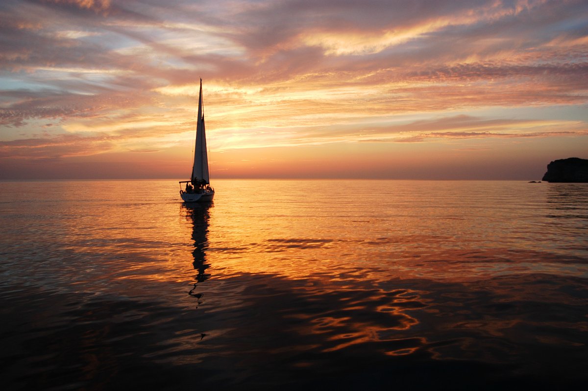Beautiful pictures of sailing boats on the sea at dusk