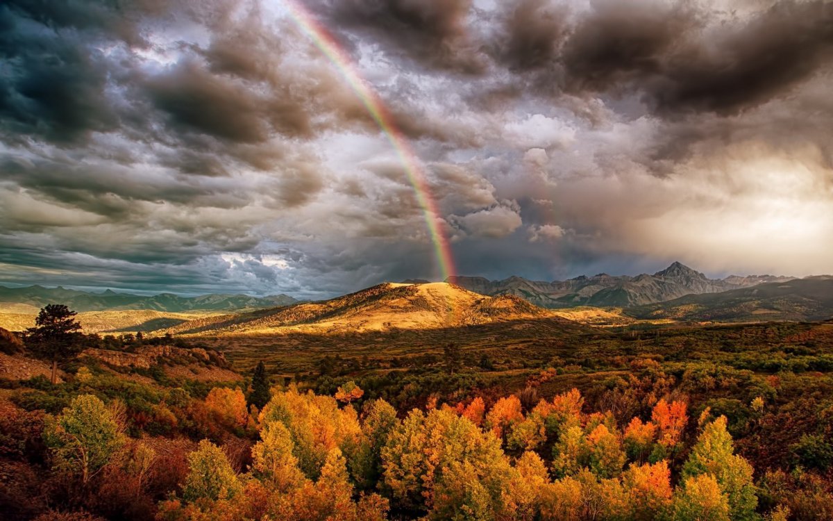 Rainbow landscape picture after rain
