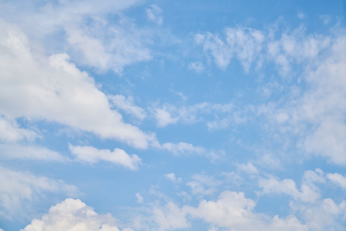 Blue sky floating clouds background picture
