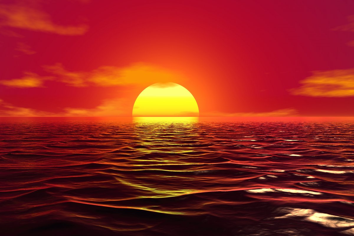 Picture of red sun rising over sea level