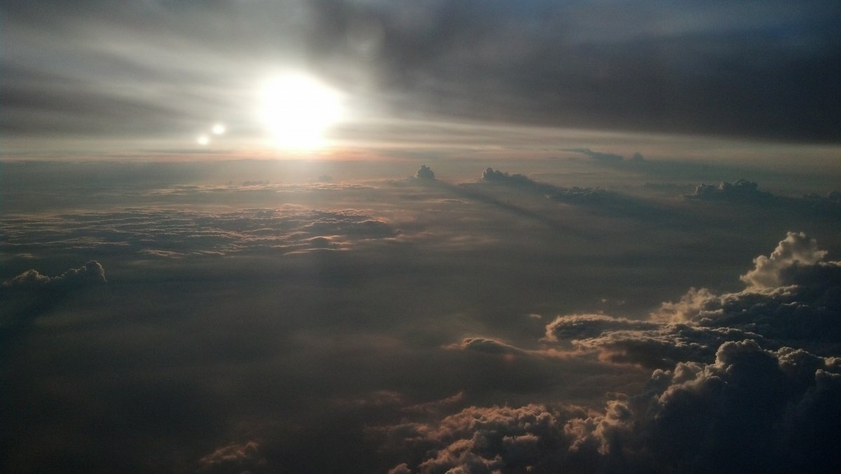 Sunrise landscape picture above clouds