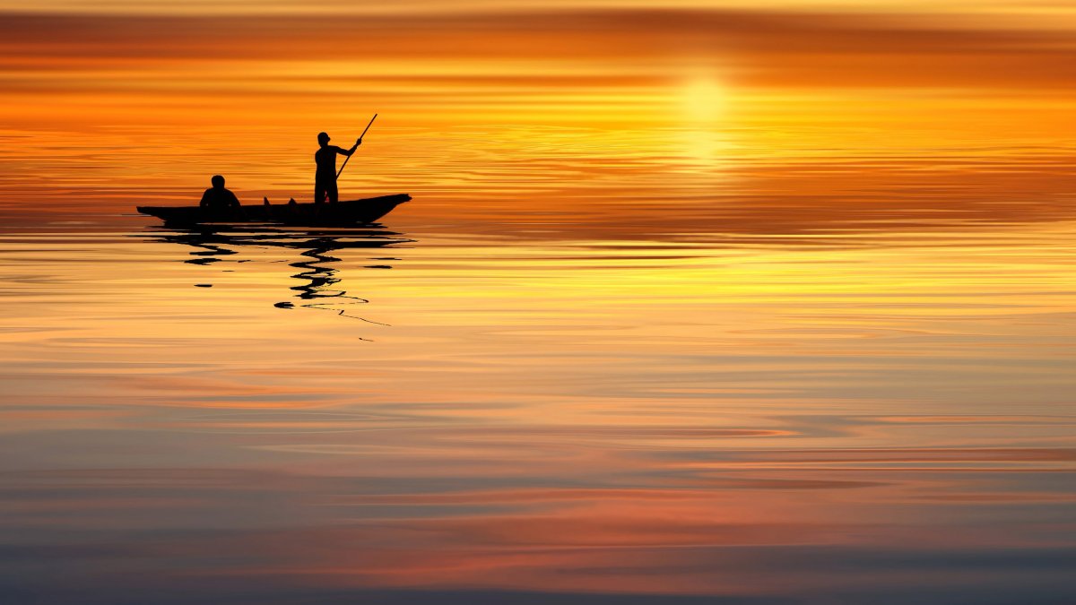 Boating silhouette picture at sunset