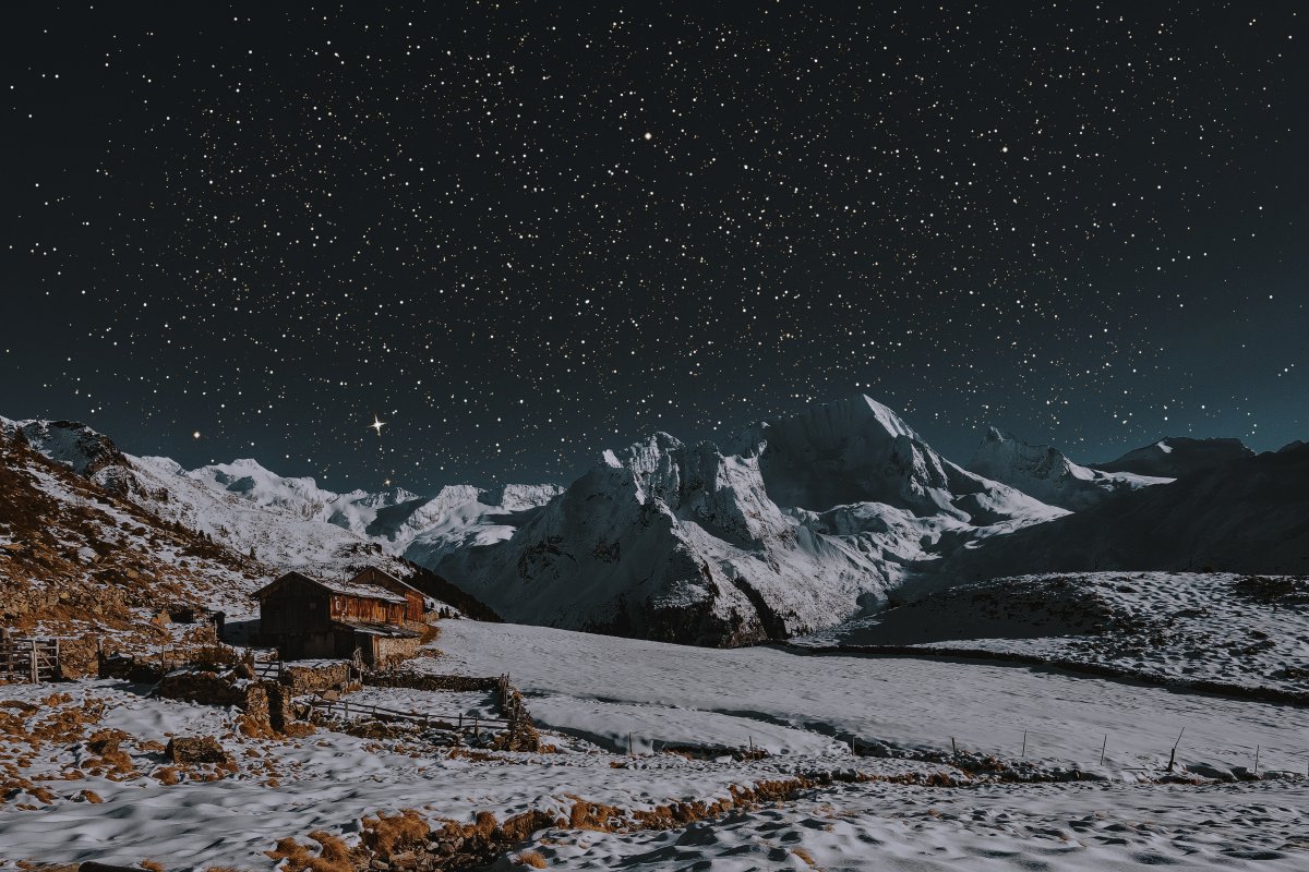 Starry sky pictures on snowy mountains at night
