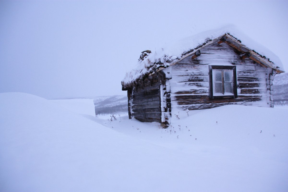 Pictures of wooden houses in the snow in winter
