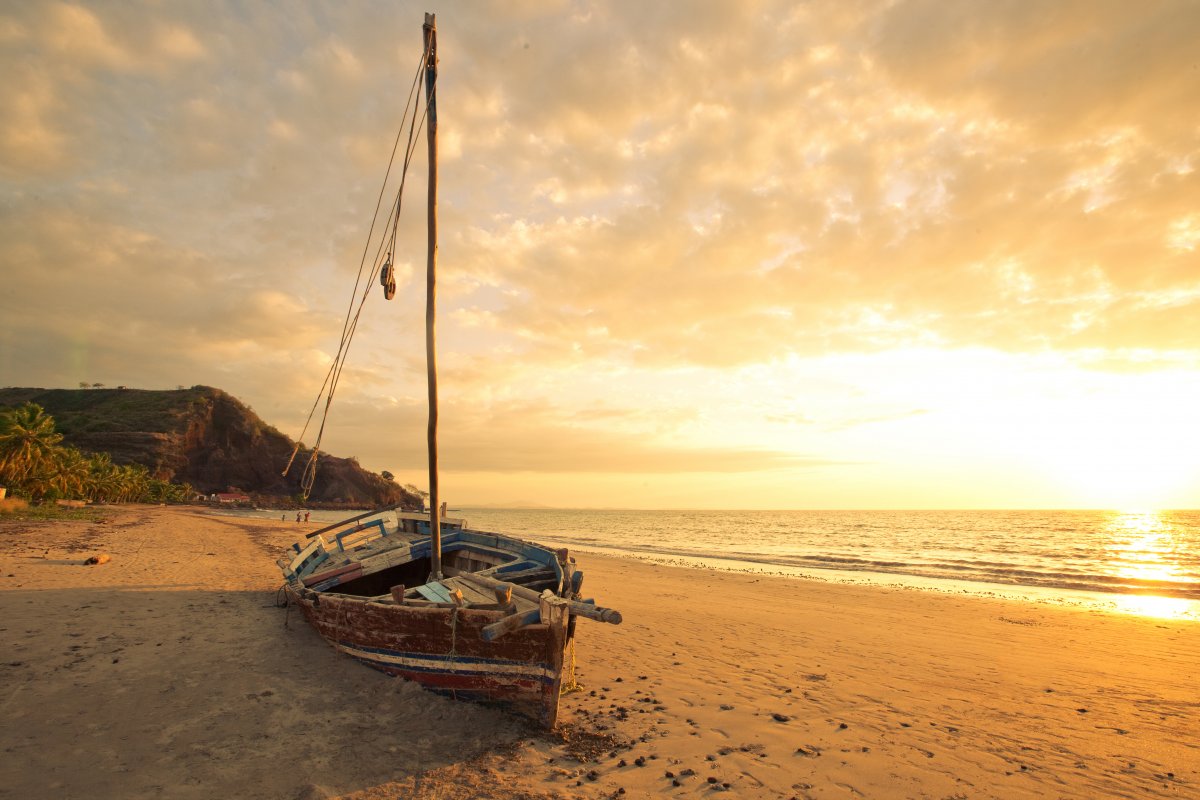 Picture of boat on beach at sunrise at seaside