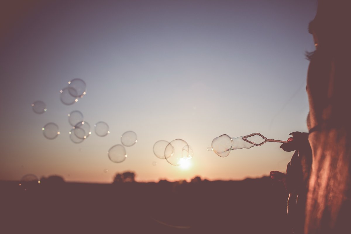 Beautiful dusk pictures of blowing bubbles