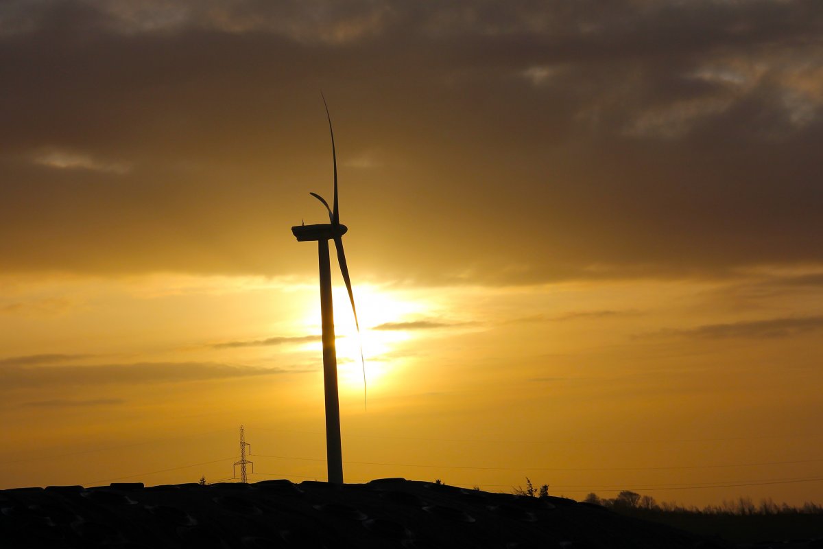 Picture of windmill generating electricity at dusk