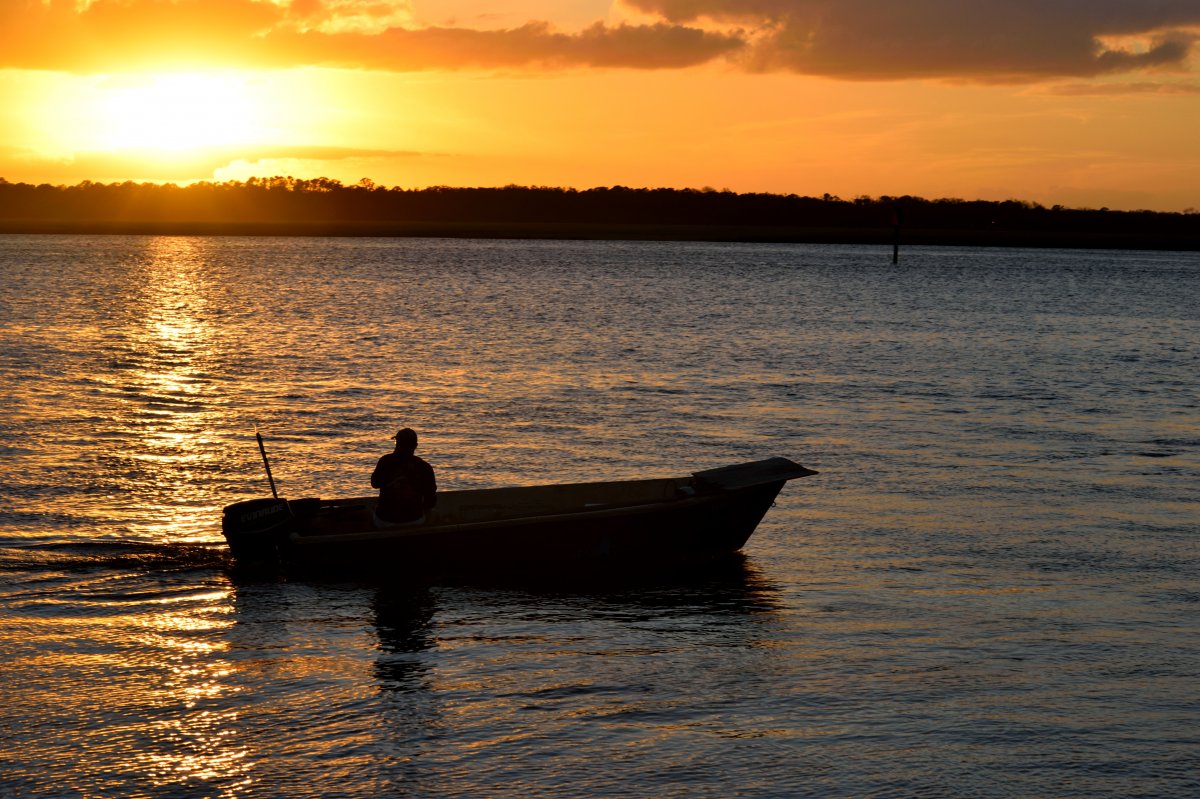 Picture of fishing boat at sunset on the sea