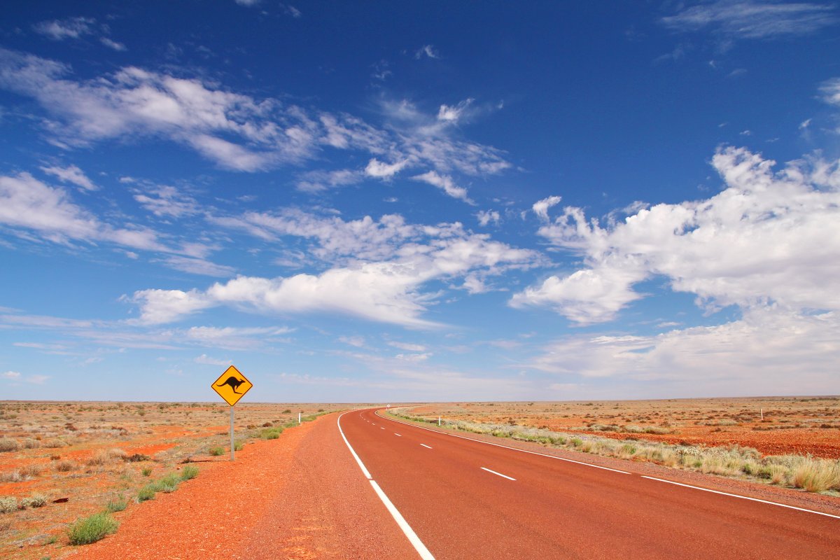 Pictures of desolate desert with blue sky and white clouds