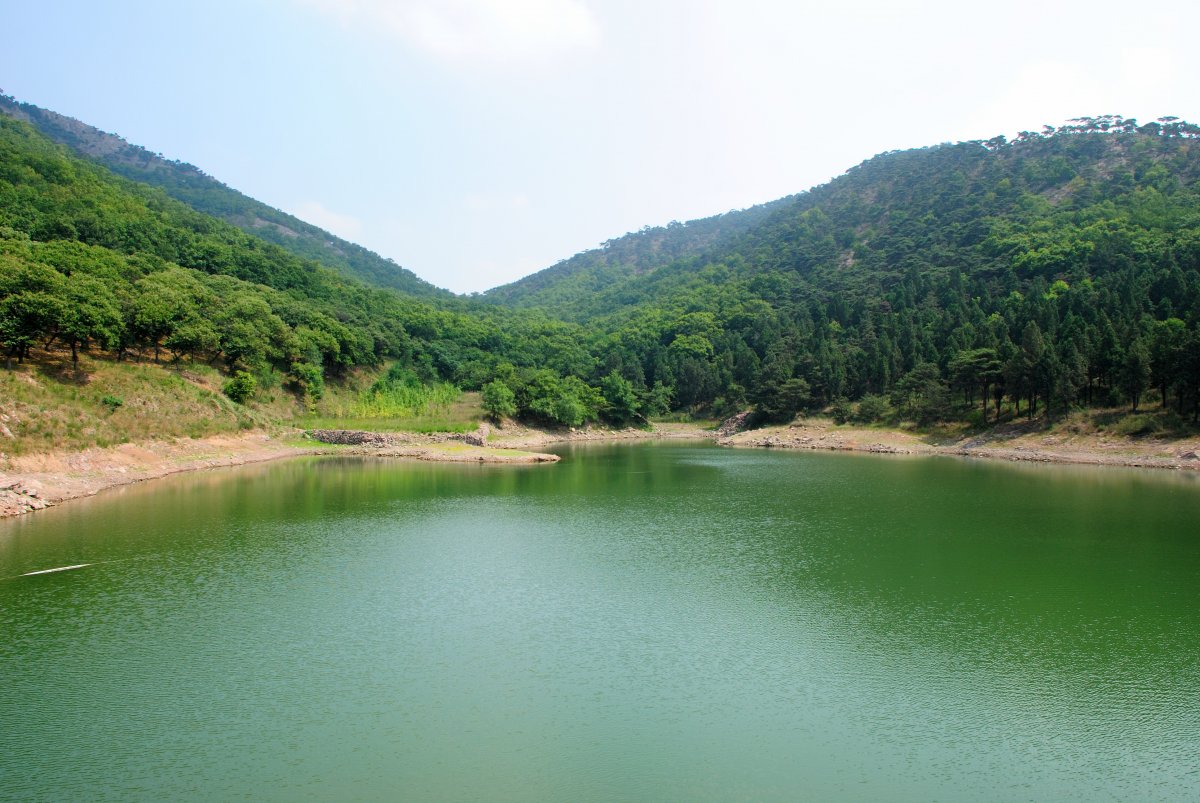 Picture of lake under green hillside