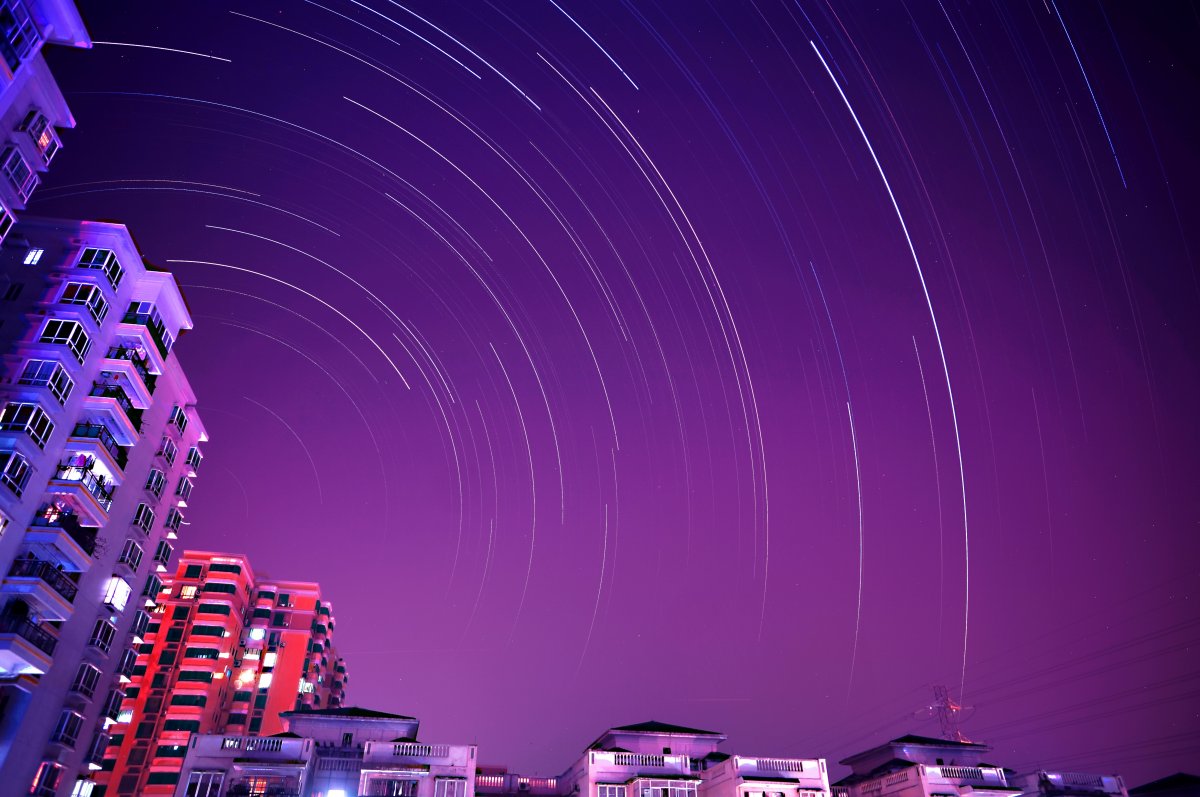 Purple night sky meteor shower picture