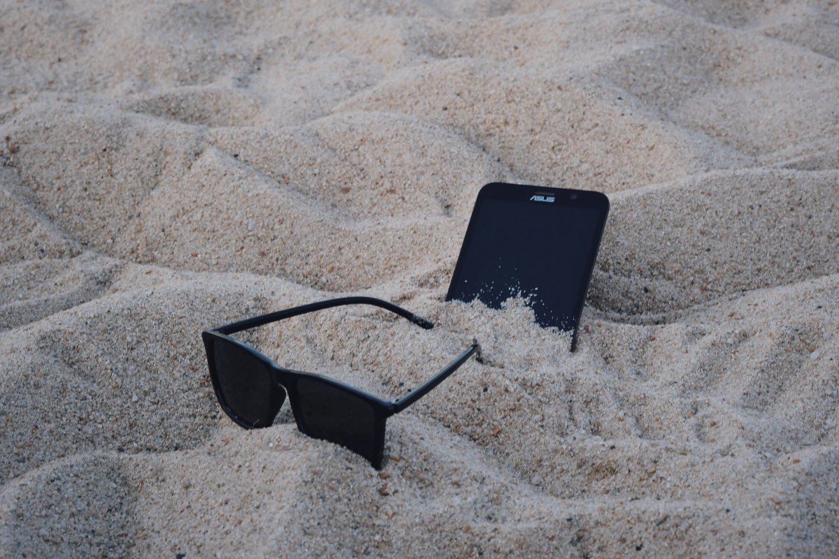 Beach sunglasses and mobile phone pictures