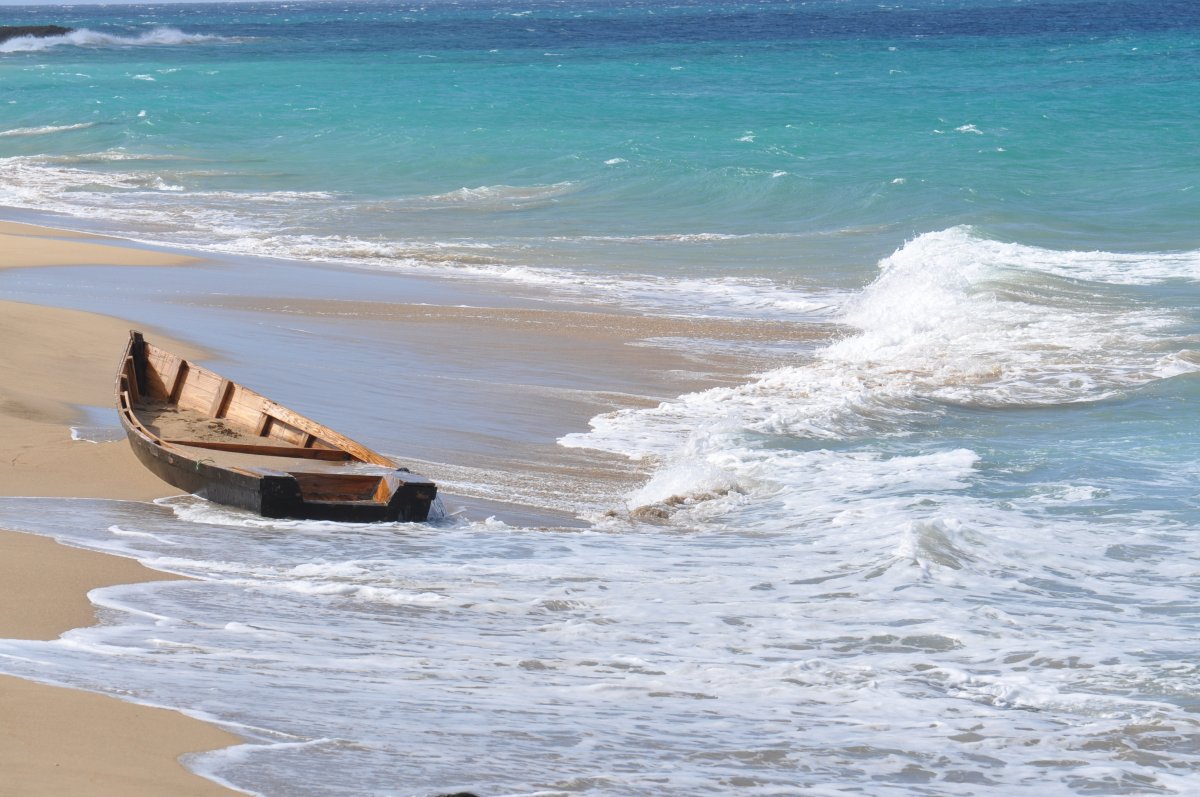 Pictures of wooden boats on the beach